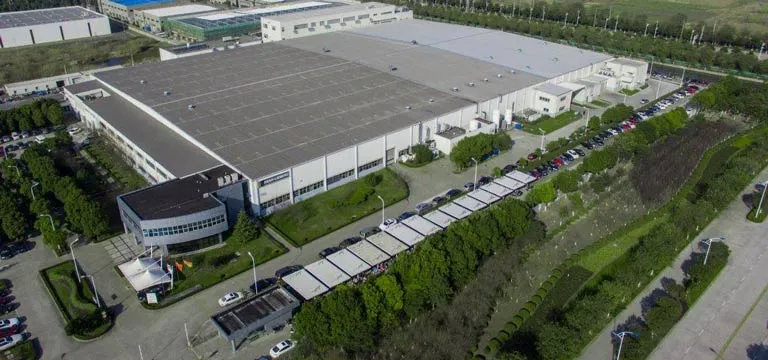 Aerial view of a large production hall with photovoltaic roof at the site in China