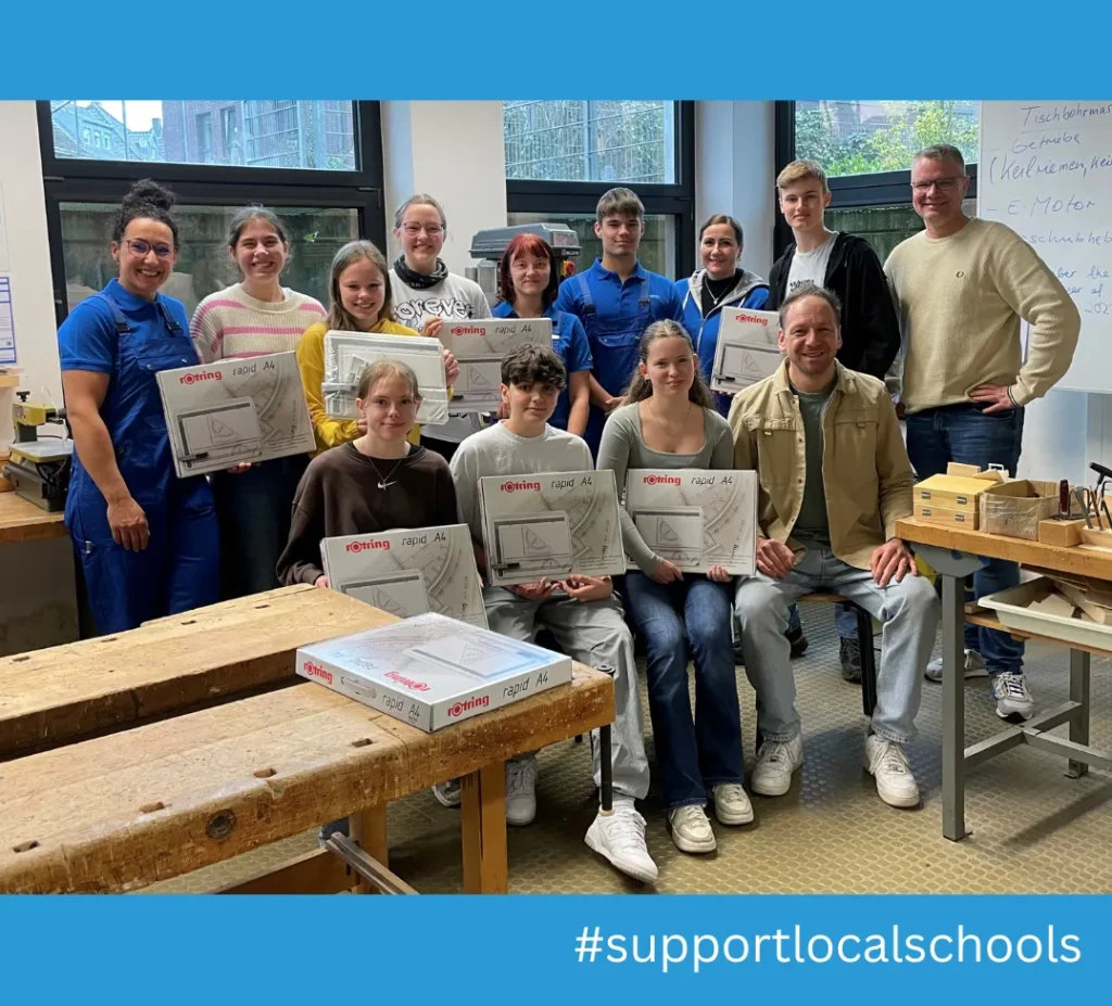 Group of people with construction kits in a workshop for the supportlocalschools campaign